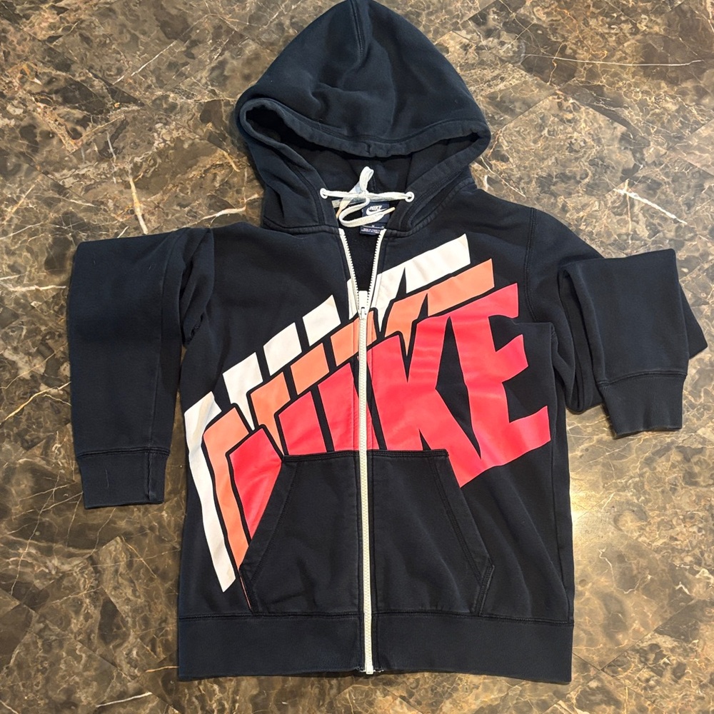 Nike Women’s Black Hoodie with Red Orange and White Graphic. Zipper front.